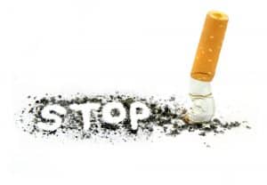 stop smoking written in ash from a cigarette