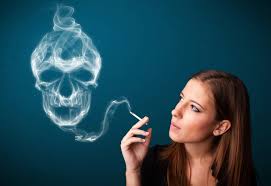 person smoking and the smoke makes the shape of a skull